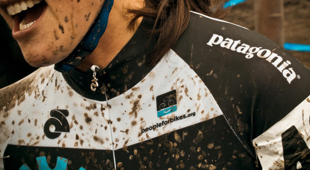 patagonia ad with mud on cyclist