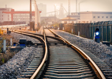 Industrial railway track at dusk - Brand Stories Matter