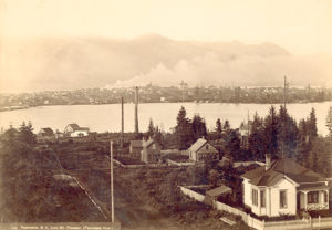 1891; Photograph shows a view of Strathcona and Strathcona School across False Creek from Mount Pleasant.